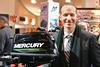Mercury Marine director of global public relations and communications, Lee Gordon, unveils the new Mercury 5hp propane outboard at the Toronto show