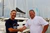 Phillip Winter, partner manager for Navigare Yachting USA, shakes hand with AYS co-owner Chris Humphreys