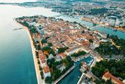 aerial-drone-view-zadar-sunset-croatia-historical-city-centre-with-old-buildings_1268-23576