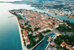 aerial-drone-view-zadar-sunset-croatia-historical-city-centre-with-old-buildings_1268-23576