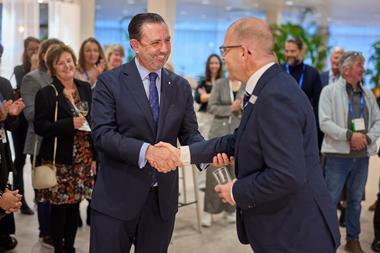 Niels Klarenbeek IFBSO President congratulating Minister Alejandro Sáenz de San Pedro