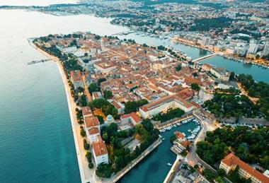 aerial-drone-view-zadar-sunset-croatia-historical-city-centre-with-old-buildings_1268-23576