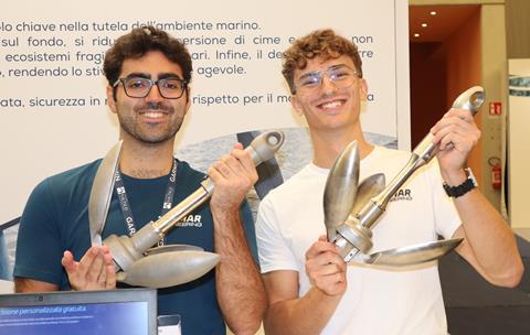 Allessandro Bruzzone(left) and Riccardo Gerbi pose with prototypes of the Abissa anchor. Note the collar that is over the base of the shank. This holds in a retaining pin, which is used when the folding mechanism needs to be overridden