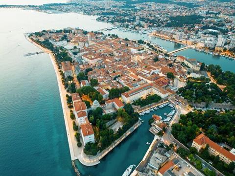 aerial-drone-view-zadar-sunset-croatia-historical-city-centre-with-old-buildings_1268-23576